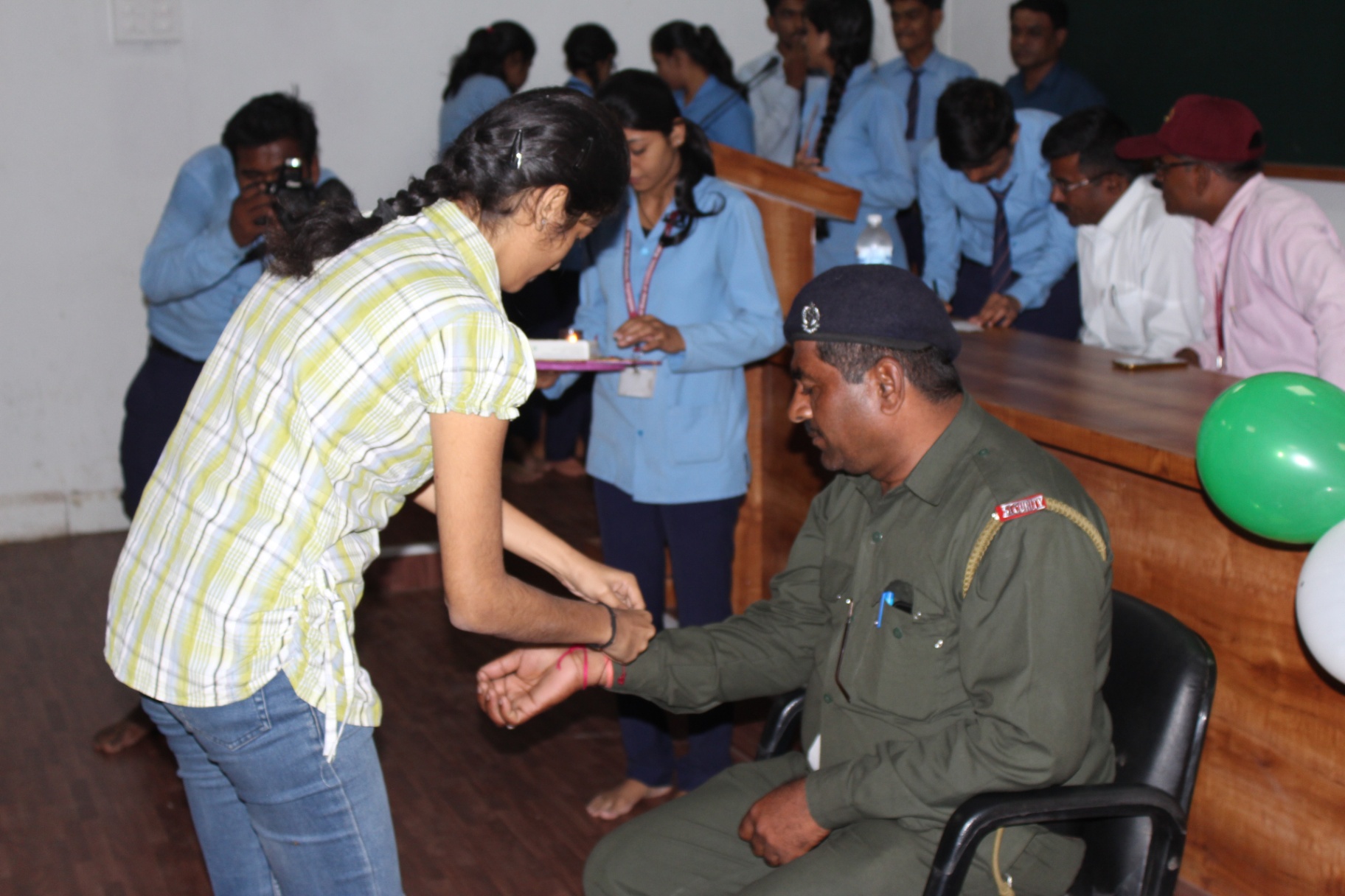 Students tie rakhi to on-campus security staff
