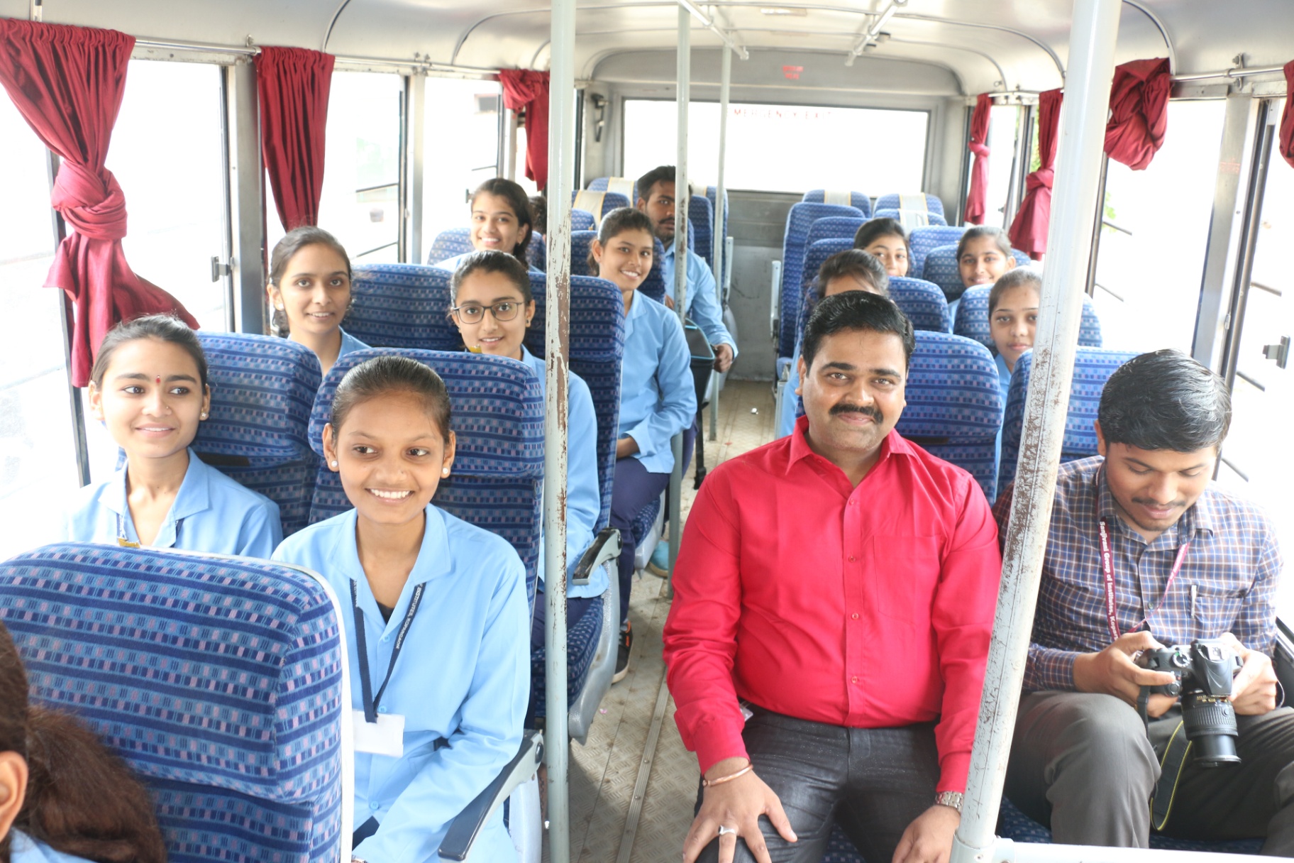 Community outreach bus — students en route to the felicitation drive